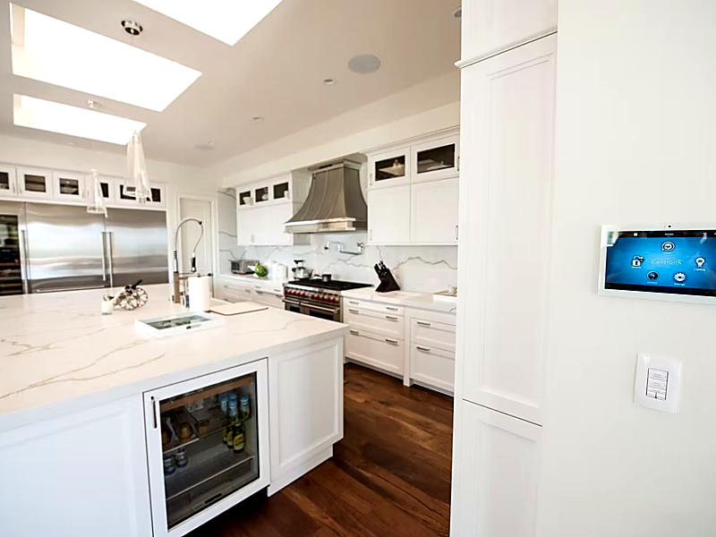 Control4 touchscreen panel in luxury kitchen — smart home automation in Westlake Village