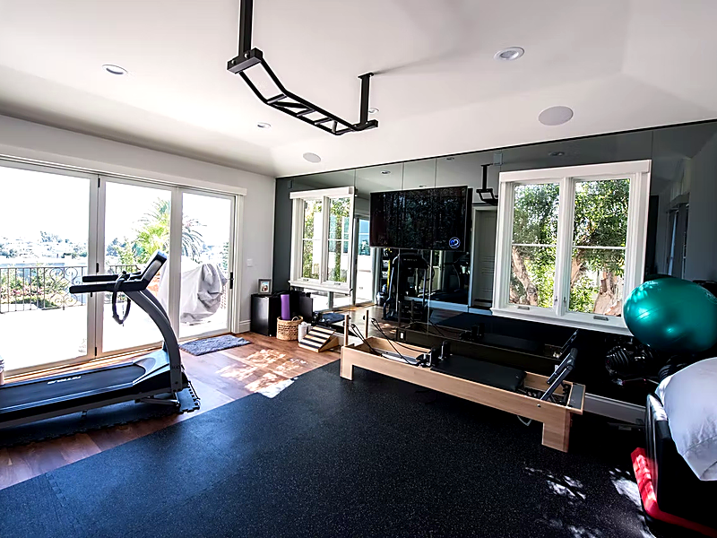 Living room with in-ceiling speakers and built-in entertainment center in Malibu